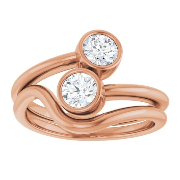 The Double Round Lab Diamond Twist Ring features two sparkling lab-grown diamonds in a unique twisted band design. Crafted in elegant rose gold, this minimalist piece symbolizes unity and love, making it perfect for couples or as a meaningful gift for any occasion.