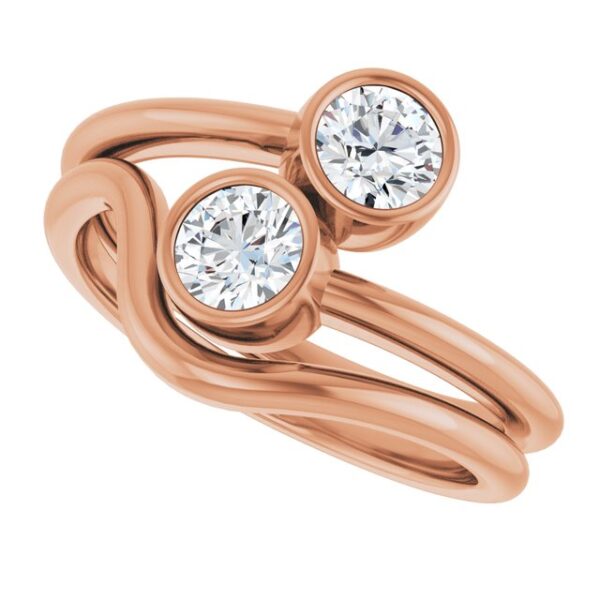 The Double Round Lab Diamond Twist Ring features two sparkling lab-grown diamonds in a unique twisted band design. Crafted in elegant rose gold, this minimalist piece symbolizes unity and love, making it perfect for couples or as a meaningful gift for any occasion.