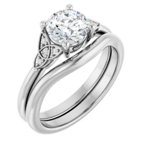 This Intertwined Diamond Bridal Set features a stunning 6.5mm round diamond engagement ring, complemented by a beautifully designed intertwined wedding band. Perfect for couples seeking a timeless and elegant symbol of their love. Crafted with precision, this set is ideal for both engagement and wedding, offering a sophisticated yet classic style.